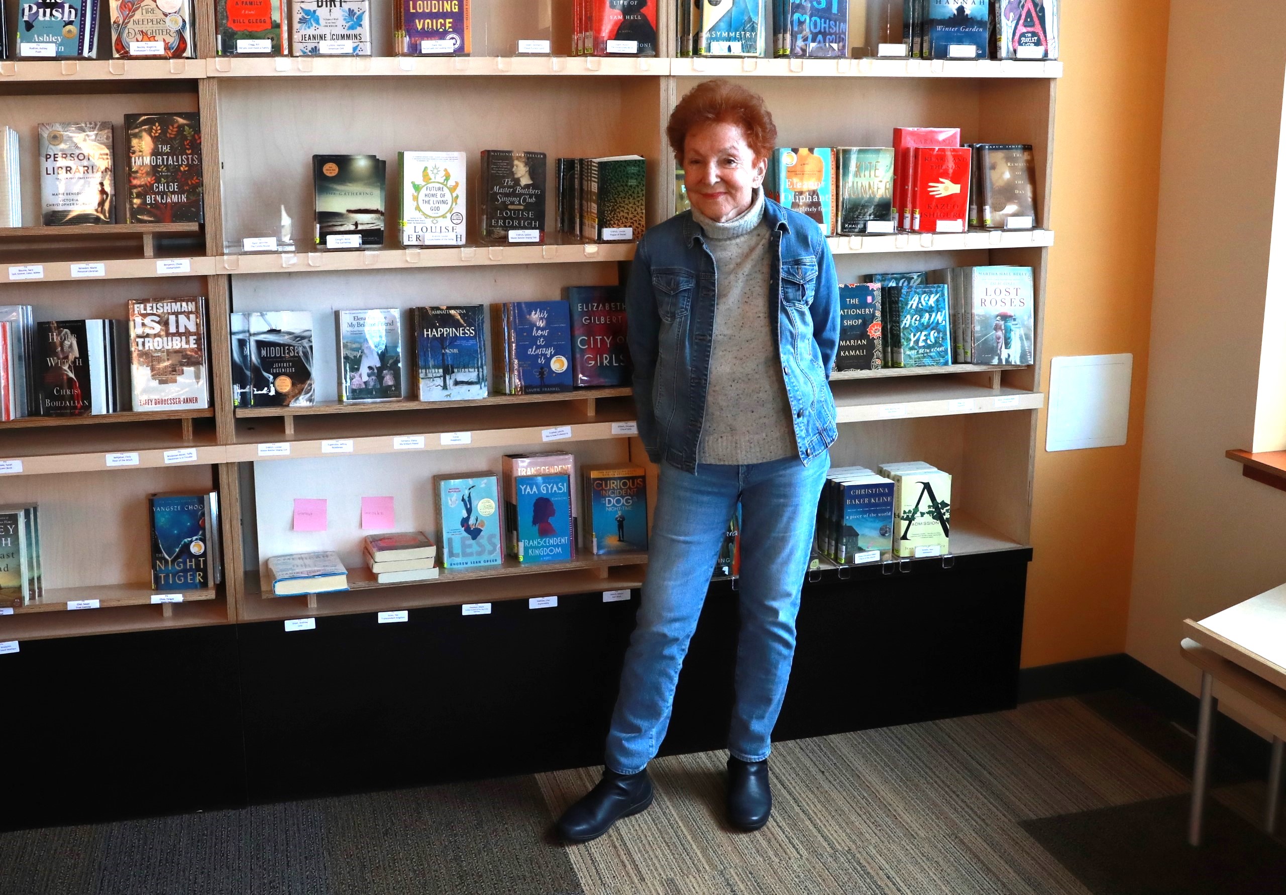 Photo of Mary-Lou Weisman in front of books